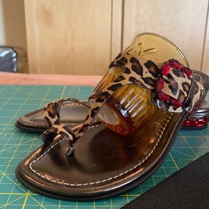 Size 6 DONALD J PLINER sandals. leopard design with red accent decor.